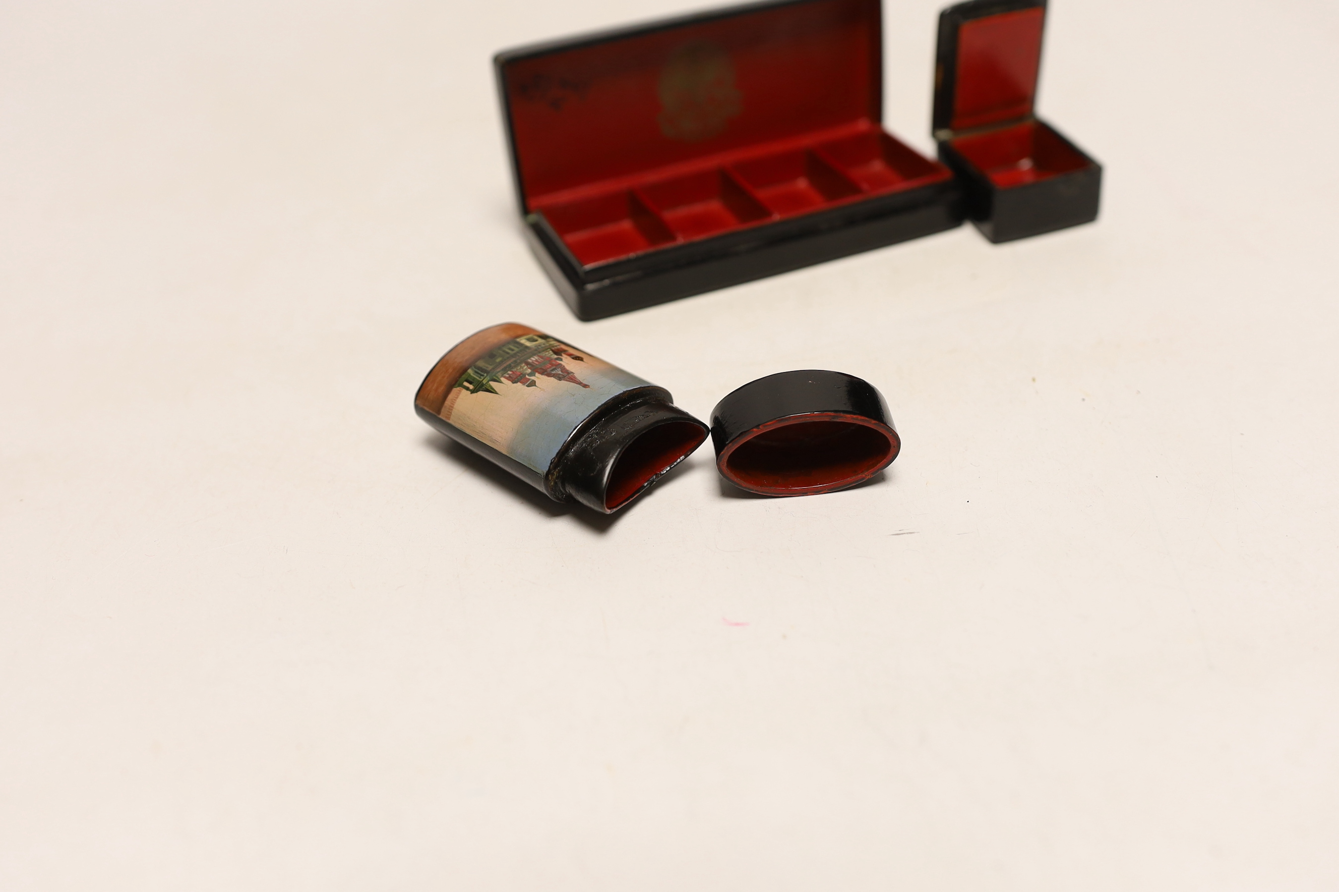 Two Russian lacquer ‘Kremlin’ stamp boxes and a similar vesta case, c.1900, largest 11cm, Please note this lot attracts an additional import tax of 5% on the hammer price